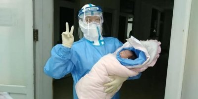 Çin'de yeni tip koronavirüs taşıyan kadın sağlıklı bir bebek dünyaya getirdi